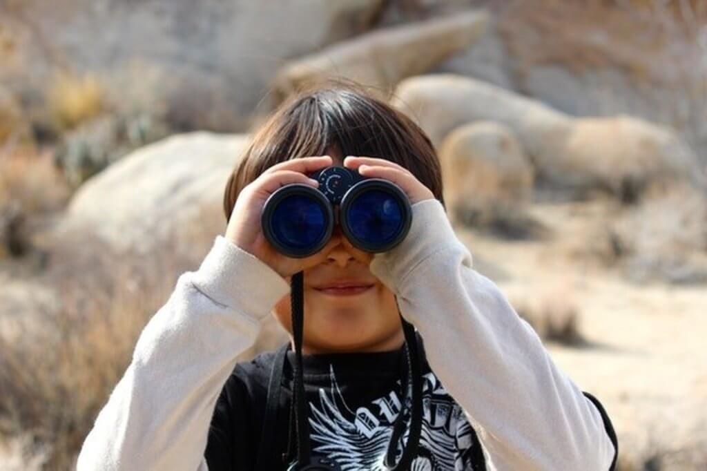 young boy with binoculars