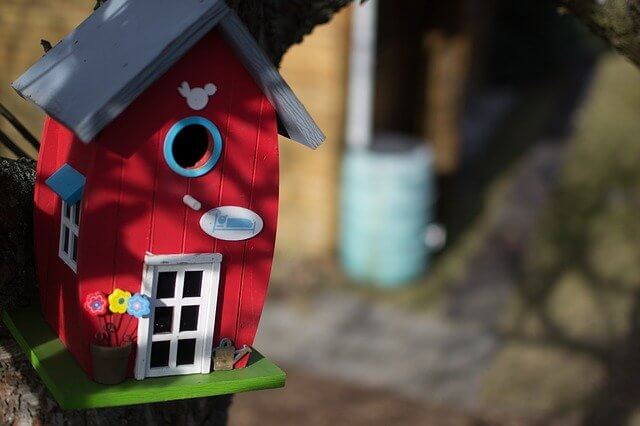A red birdhouse.