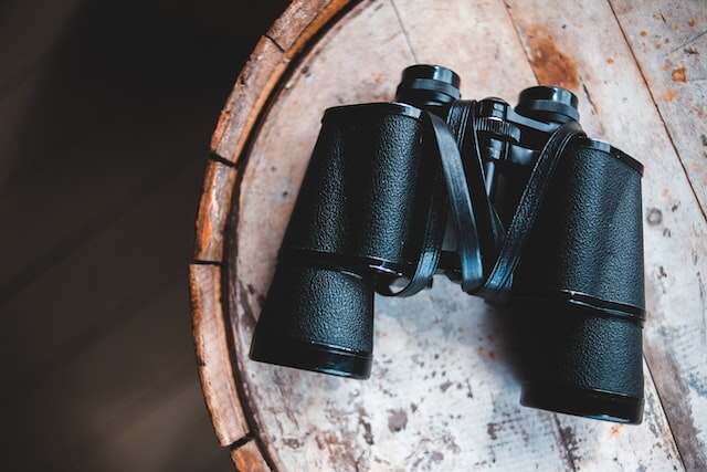 A pair of binoculars resting on a table.